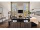 Spacious living room with soaring ceilings, fireplace, and tall windows offering plenty of natural light at 3720 River Mansion Dr, Peachtree Corners, GA 30096
