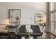Comfortable living room featuring modern decor and an arched doorway to the dining area at 3720 River Mansion Dr, Peachtree Corners, GA 30096