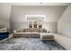 This living room features a large window, plush sectional, and stylish area rug, perfect for relaxing and entertaining at 3720 River Mansion Dr, Peachtree Corners, GA 30096