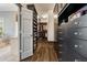 Custom walk-in closet with hanging racks and drawer storage at 3720 River Mansion Dr, Peachtree Corners, GA 30096