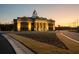 Exterior shot showcasing the Lumbar Municipal Complex's architectural design and surrounding landscape at dusk at 54 Black Gum Ln # 48, Auburn, GA 30011