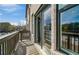 Spacious balcony with sliding doors and brick accents overlooking the neighborhood at 608 Marimba Pike, Mcdonough, GA 30253
