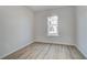 Bright bedroom boasts hardwood flooring, neutral walls, natural light, and modern finishes at 608 Marimba Pike, Mcdonough, GA 30253