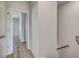 View down the hallway with hardwood floors leading to another room at 608 Marimba Pike, Mcdonough, GA 30253