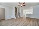 View of hallway to bathroom, with hardwood floors and a white painted door at 608 Marimba Pike, Mcdonough, GA 30253