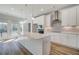 Bright kitchen featuring white cabinets, quartz countertops, subway tile backsplash, and stainless steel appliances at 608 Marimba Pike, Mcdonough, GA 30253