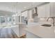 Bright kitchen featuring white cabinets, quartz countertops, subway tile backsplash, and stainless steel appliances at 608 Marimba Pike, Mcdonough, GA 30253