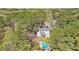 Bird's-eye view of this beautiful home with a pool, nestled in a serene, wooded area at 1260 Centenary Rdg, Snellville, GA 30078