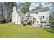 View of white house showing deck, walkout basement, garage, basketball hoop and backyard at 1260 Centenary Rdg, Snellville, GA 30078