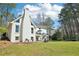 View of white house showing deck, patio, basketball hoop, trampoline and backyard at 1260 Centenary Rdg, Snellville, GA 30078