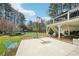 Backyard showing basketball hoop, trampoline and distant view of the pool area at 1260 Centenary Rdg, Snellville, GA 30078