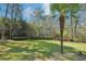 Spacious backyard is perfect for outdoor activities, complemented by lush greenery and mature trees at 1260 Centenary Rdg, Snellville, GA 30078