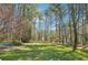 Well-maintained backyard offers ample space for recreation and features mature trees for privacy at 1260 Centenary Rdg, Snellville, GA 30078