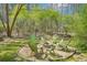 Backyard firepit area with gravel base and circle of green adirondack chairs at 1260 Centenary Rdg, Snellville, GA 30078