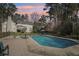 Stunning backyard with a large in-ground pool and mature trees, perfect for outdoor enjoyment at 1260 Centenary Rdg, Snellville, GA 30078