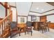 Finished basement featuring a bar with chairs and decorative wood trim on the walls and ceiling at 1260 Centenary Rdg, Snellville, GA 30078