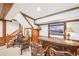 Finished basement featuring a bar with chairs and decorative wood trim on the walls and ceiling at 1260 Centenary Rdg, Snellville, GA 30078