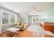 Bright and airy bedroom with hardwood floors, ceiling fan, and windows with leafy view at 1260 Centenary Rdg, Snellville, GA 30078