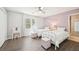 Charming bedroom features hardwood floors, ceiling fan, and two twin beds with white metal frames at 1260 Centenary Rdg, Snellville, GA 30078