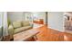 Well-lit bedroom boasts hardwood floors, couch, and attached bath at 1260 Centenary Rdg, Snellville, GA 30078