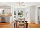 Eat-in kitchen features a charming breakfast nook with large windows and natural light at 1260 Centenary Rdg, Snellville, GA 30078