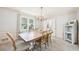 Well lit dining room highlighting a light fixture, large window, and plenty of space for the whole Gathering to dine at 1260 Centenary Rdg, Snellville, GA 30078