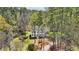 Stately home surrounded by mature trees and lush landscaping creating a private, tranquil setting at 1260 Centenary Rdg, Snellville, GA 30078