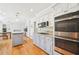 Modern kitchen includes stainless steel appliances, granite countertops, and an island for food preparation at 1260 Centenary Rdg, Snellville, GA 30078