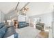 Bright living room with high ceilings, a balcony, a fireplace and wood floors, creating an open and airy atmosphere at 1260 Centenary Rdg, Snellville, GA 30078