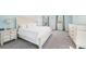 Airy main bedroom with off white bed set, gray carpet, and plentiful natural light at 1260 Centenary Rdg, Snellville, GA 30078