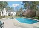The backyard has a large pool, manicured lawn, and deck, perfect for outdoor entertaining at 1260 Centenary Rdg, Snellville, GA 30078