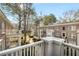 View from balcony of well maintained grounds with manicured lawns and brick buildings under a bright sky at 2260 Peachtree Nw Rd # D6, Atlanta, GA 30309
