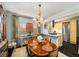 Open concept dining room flows into modern kitchen with stainless appliances, granite counters at 2260 Peachtree Nw Rd # D6, Atlanta, GA 30309