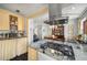 Open concept kitchen features granite countertops, stainless appliances, and flow to dining area at 2260 Peachtree Nw Rd # D6, Atlanta, GA 30309