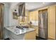 Bright, updated kitchen features stainless steel appliances, granite counters and painted cabinetry at 2260 Peachtree Nw Rd # D6, Atlanta, GA 30309