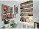 Stylish wet bar with white cabinets, wallpapered wall, and art at 2260 Peachtree Nw Rd # D6, Atlanta, GA 30309