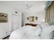 Bright main bedroom with a four-poster bed, white walls and bright natural light at 2260 Peachtree Nw Rd # D6, Atlanta, GA 30309