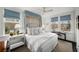 Bright main bedroom with a four-poster bed, white walls and bright natural light at 2260 Peachtree Nw Rd # D6, Atlanta, GA 30309
