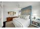Bright main bedroom with a four-poster bed, white walls and bright natural light at 2260 Peachtree Nw Rd # D6, Atlanta, GA 30309