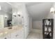 Bright bathroom featuring a large mirror and a clean white vanity at 26 Standish Nw Ave, Atlanta, GA 30309