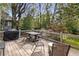 Outdoor dining area with a table and chairs, perfect for entertaining, with a lush backyard view at 26 Standish Nw Ave, Atlanta, GA 30309