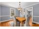 Charming dining room with hardwood floors, stylish lighting, and classic decor at 26 Standish Nw Ave, Atlanta, GA 30309