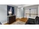 Hallway features hardwood floors, a black settee and stylish art at 26 Standish Nw Ave, Atlanta, GA 30309