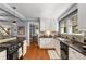 Well-appointed kitchen with hardwood floors, granite counters, and white cabinetry at 26 Standish Nw Ave, Atlanta, GA 30309