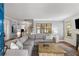 Inviting living room with hardwood floors, a gray sectional sofa, and stylish decor at 26 Standish Nw Ave, Atlanta, GA 30309
