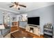 Open-concept living room with hardwood floors, modern furniture, and a view into the kitchen at 26 Standish Nw Ave, Atlanta, GA 30309