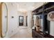 Bright foyer with light wood floors, coat rack, and chandelier; leads to other parts of the home at 612 Marimba Pike, Mcdonough, GA 30253