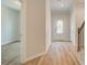 Bright entryway featuring hardwood floors, white trim, and an open doorway at 612 Marimba Pike, Mcdonough, GA 30253
