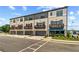 Modern townhomes with brick facade, gray trim, garage, and DRB Homes office at 612 Marimba Pike, Mcdonough, GA 30253