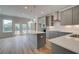 Spacious kitchen with a large island, stainless appliances, and hardwood floors at 612 Marimba Pike, Mcdonough, GA 30253